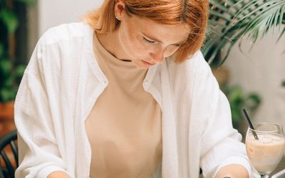 Professional working at a desk with laptop.
